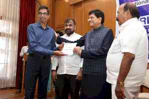 Piyush Goyal hands over salary dues to NTC employees