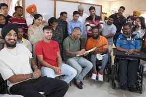 Punjab Kings players interact with patients with spinal injuries