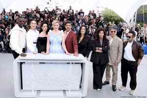 Cannes competition jury headed by Greta Gerwig poses for shutterbugs on the Croisette