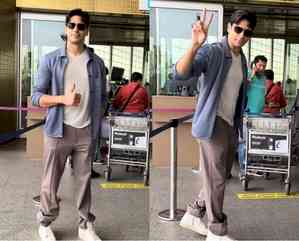 Sidharth Malhotra en route to Delhi to cast his vote, shows victory sign to paparazzi