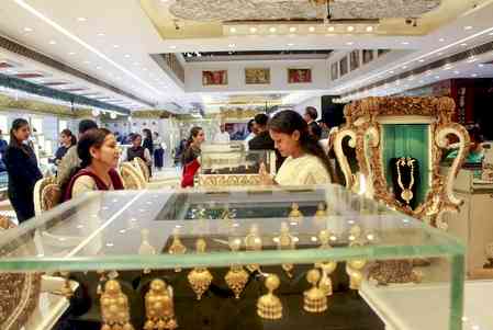 Gold prices drop sharply by Rs 2,375 per 10 grams; silver also falls