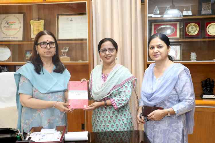Prof.  Satvinderpal Kaur Presents Her International Publication to PU Vice Chancellor 
