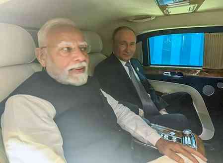 Bonhomie on display as PM Modi, Putin travel in same car