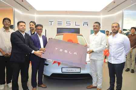 Maharashtra transport minister becomes first Tesla Model Y owner in India, vows to raise awareness about EVs