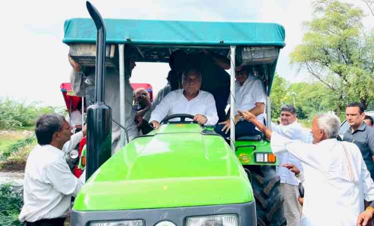 Former CM Hooda drives a tractor to visit flood-affected areas for the second consecutive day