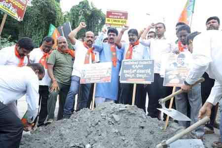 K'taka BJP launches statewide protest against Cong govt over pothole-ridden roads