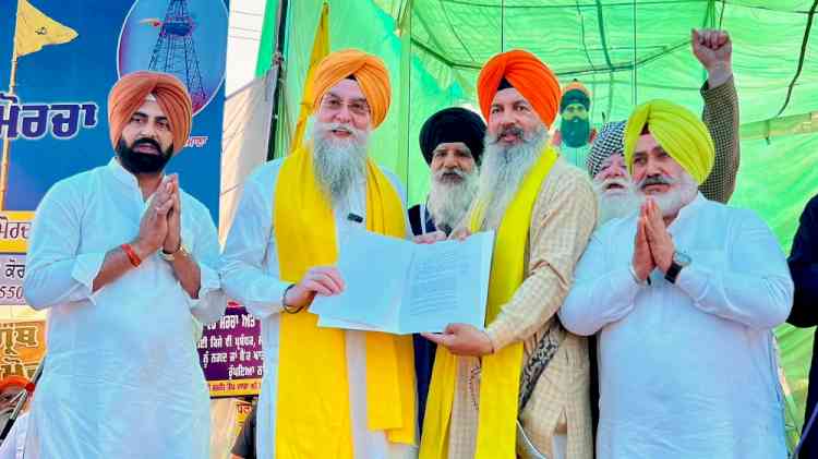 VS Speaker Kultar Sandhwan hands over a copy of the Jagat Jyot Sri Guru Granth Sahib Satkar (Amendment) Bill to Samana Morcha Sangat