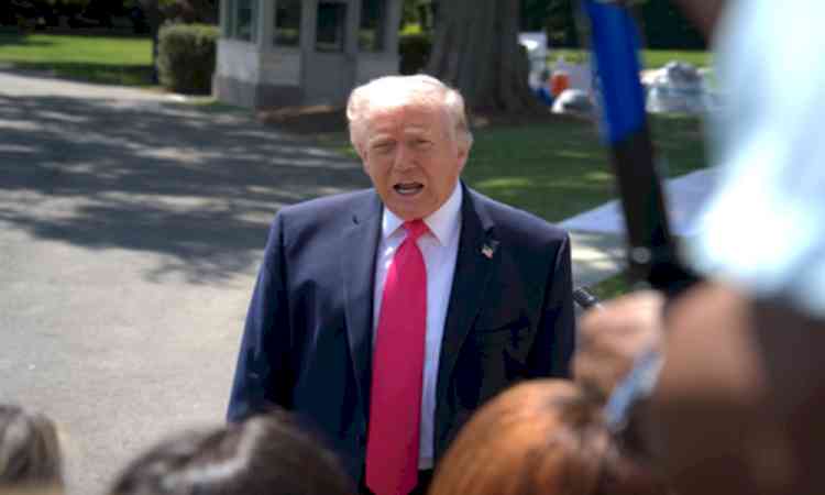 Trump warns Iran, says talks underway