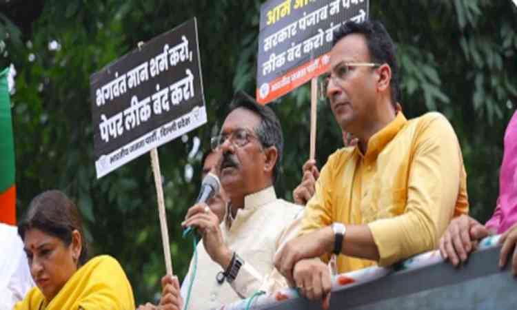 Delhi BJP chief leads protest against paper leaks in Punjab, seeks AAP Minister's dismissal