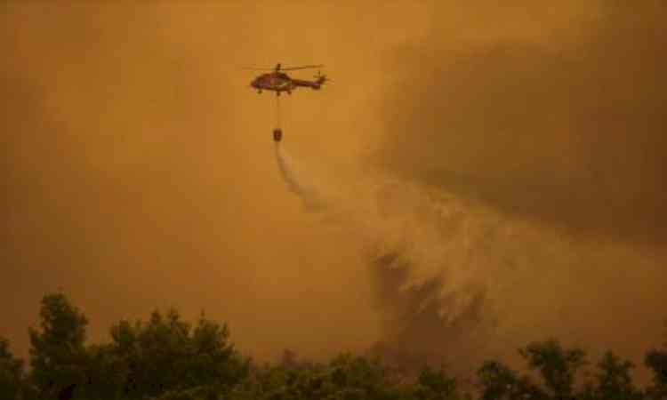 Two firefighting helicopters collide while battling wildfire in Greece