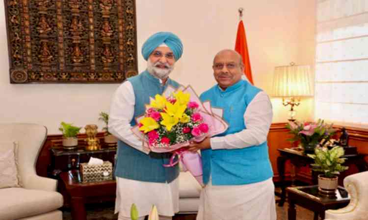 Delhi Assembly Speaker presents magazine to L-G